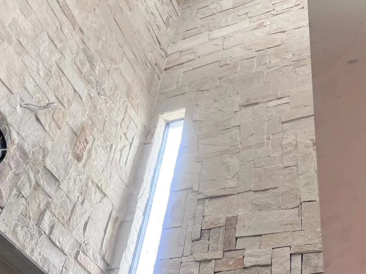Stone cladding installed on a residential feature wall and column.